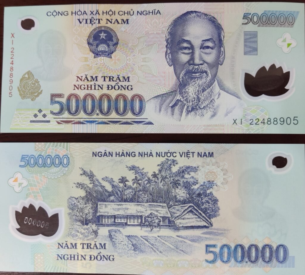 Photo recto verso d'un billet vietnamien d'une valeur de 500.000 VND, la monnaie officielle du Vietnam